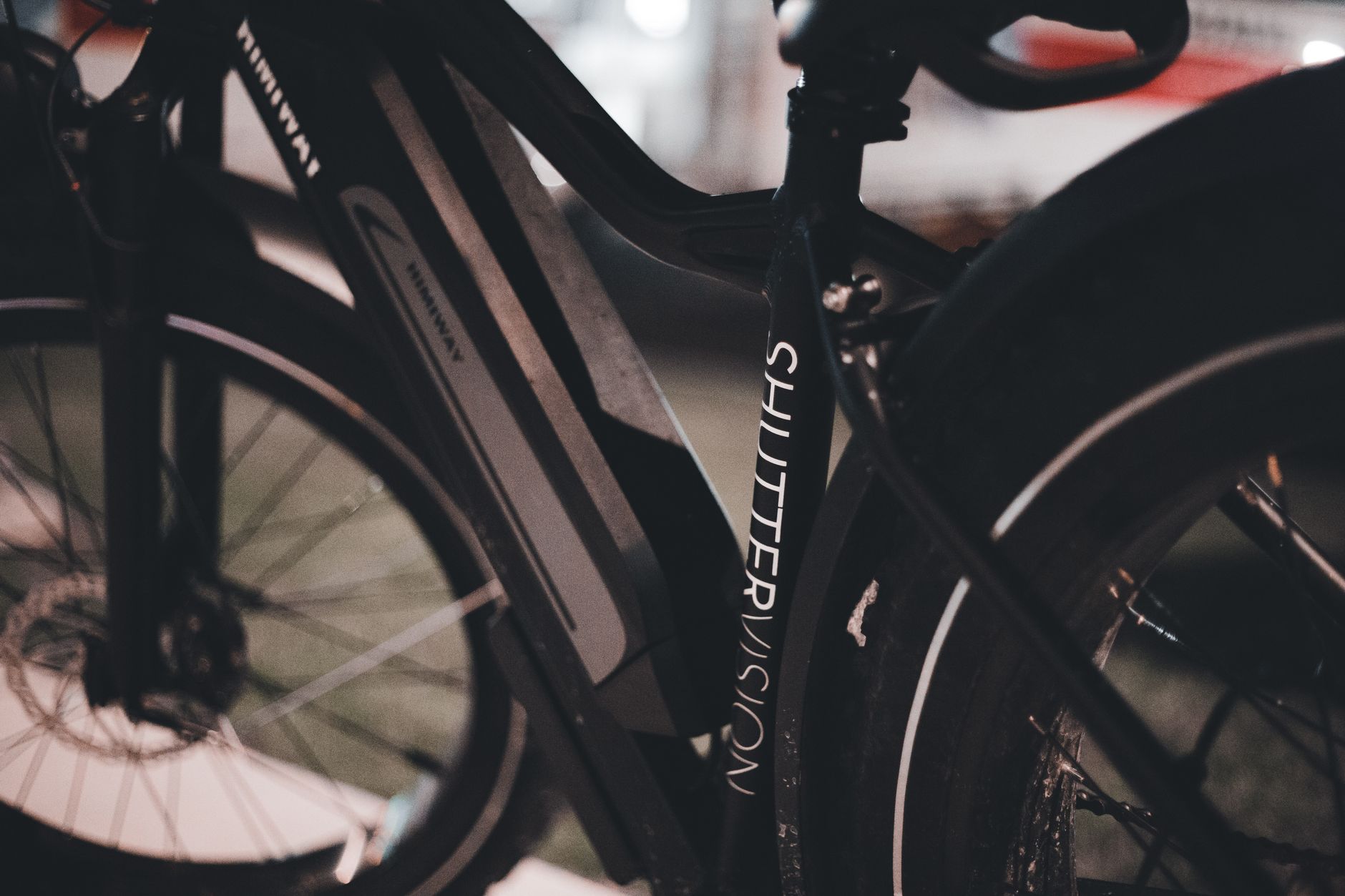 Detailed close-up of a modern electric bicycle with SHUTTLEVUSION branding.