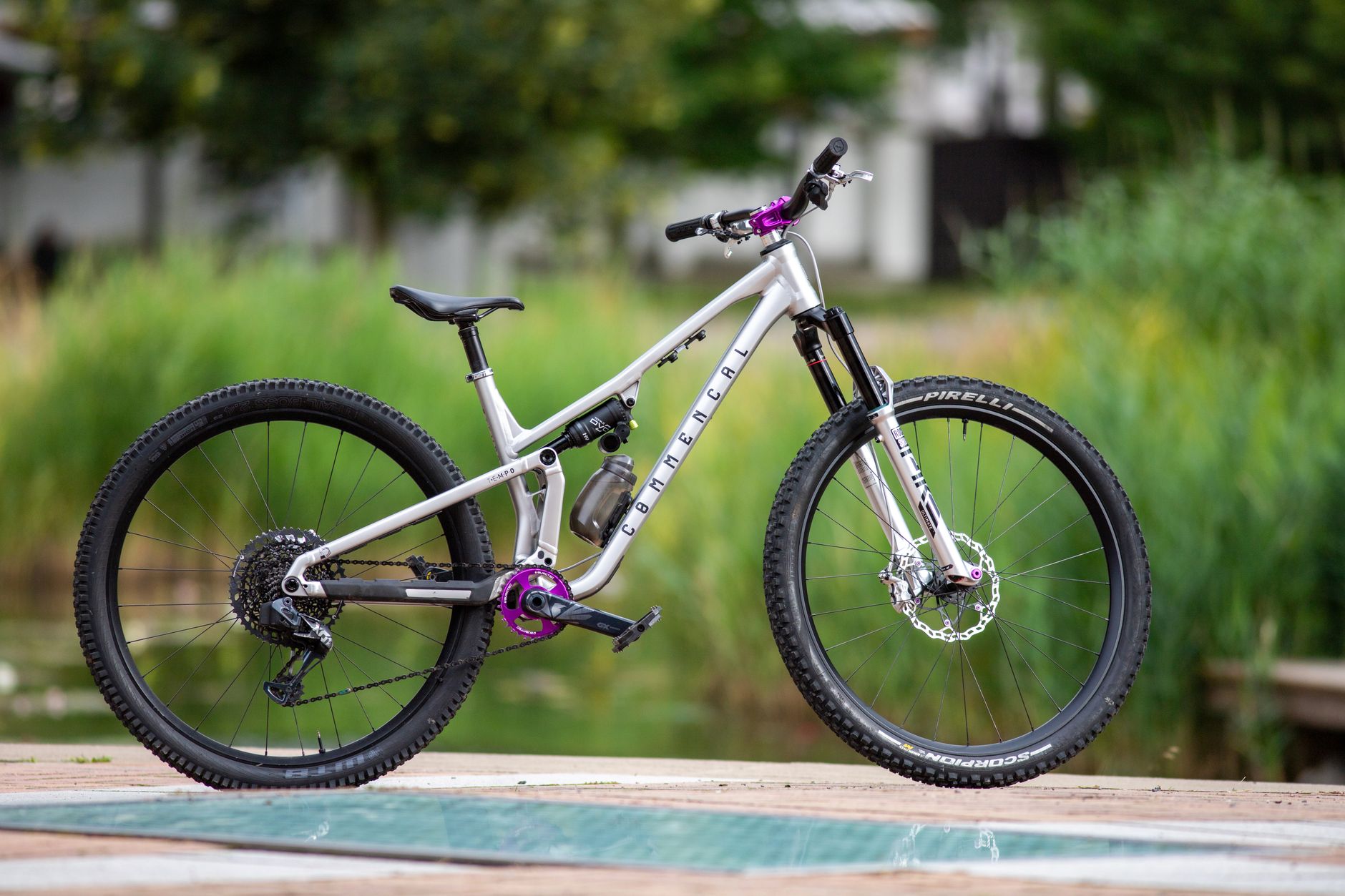A sleek mountain bike displayed on an outdoor wooden platform in Prague, highlighting its design.