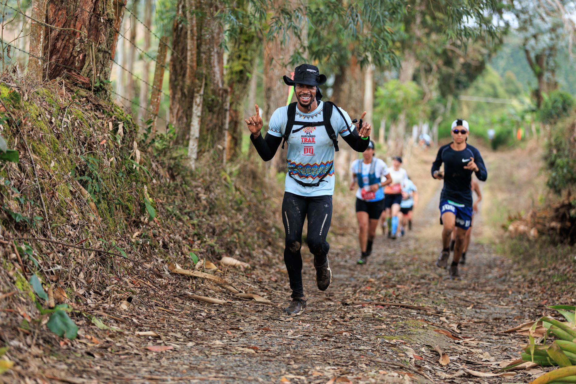 Trail runners racing through a forest path, enjoying the natural setting and camaraderie.