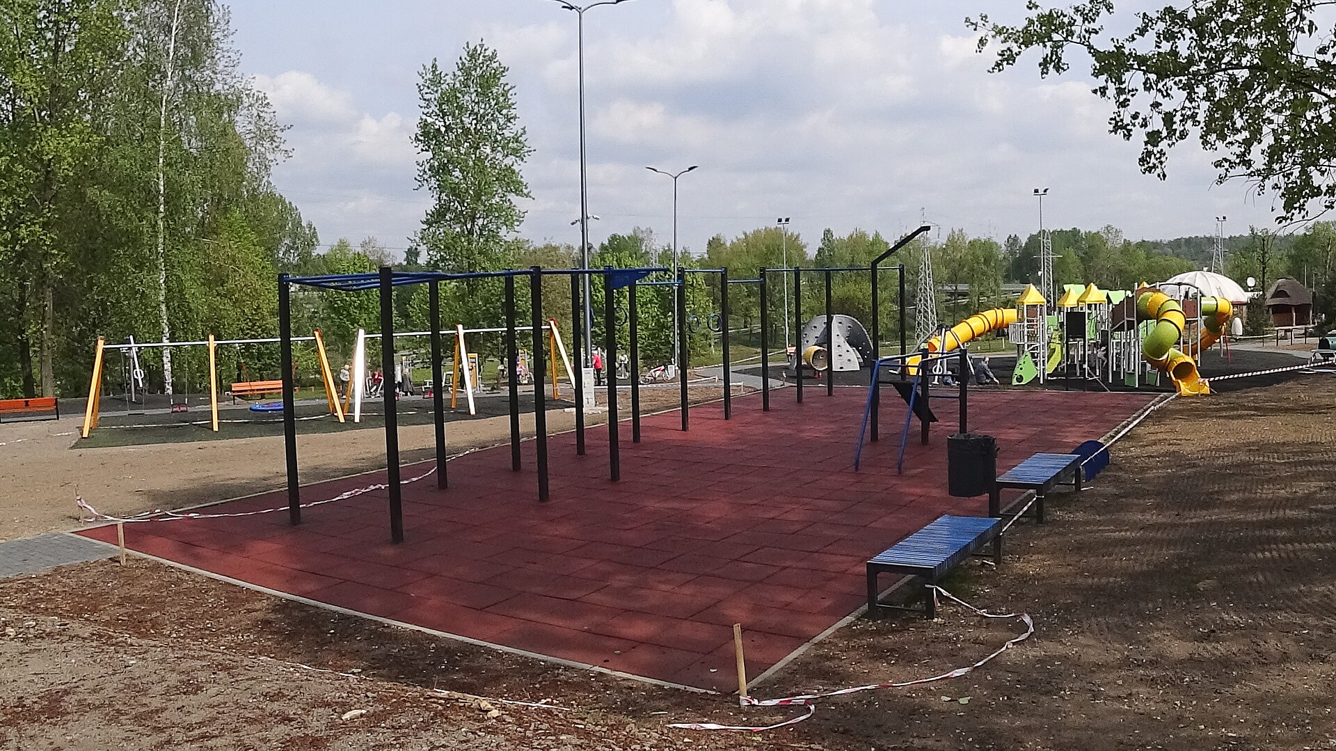 Playground and street workout area in Środula Park in Sosnowiec, Środula district, Silesian Voivodeship, Poland, on 27 April 2018. The photo