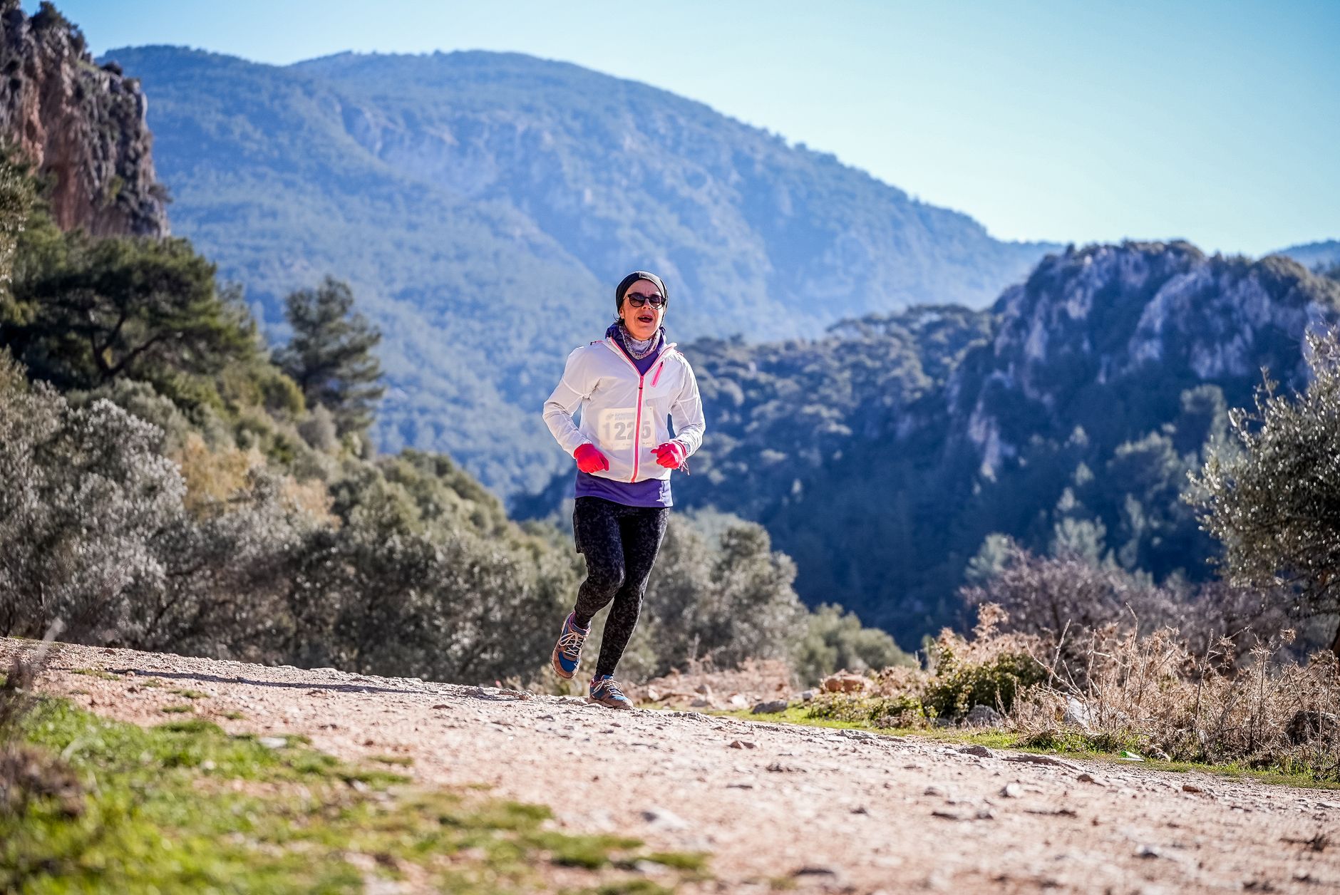 Woman running in the natural beauty of Izmir mountains, Turkey.